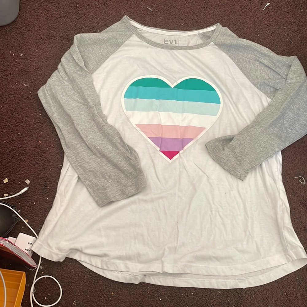 Ellen EV1 long sleeve top with a colored heart on it.